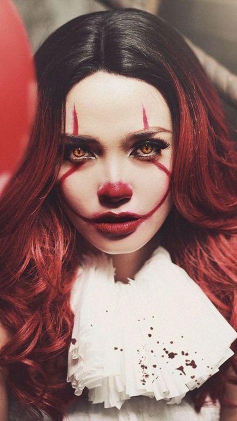 a woman with red hair and makeup is dressed as a clown