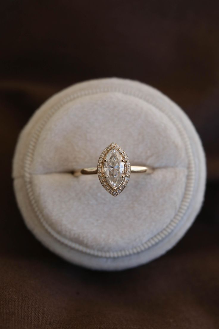 an engagement ring in a velvet box