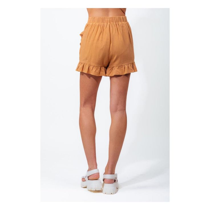 Upgrade your summer wardrobe with our stunning High-Waisted Linen Skort in the beautiful camel hue. At PinkPro Beauty, we offer a fashion-forward solution that combines the best of shorts and skirts into one versatile garment. This skort features a flattering high-waisted design that accentuates your curves and offers a comfortable fit. Crafted from high-quality linen fabric, our skort guarantees breathability and durability, ensuring you stay cool and stylish even on the hottest days. The ruffl Brown Summer Bottoms With Elastic Waistband, Summer Brown Bottoms With Elastic Waistband, Beige Bottoms For Summer, Beige Summer Shorts For Outings, Beige Bottoms For Summer Outings, Beige Shorts For Summer Outings, Beige Summer Style Shorts, Brown Summer Shorts With Elastic Waistband, Summer Brown Shorts With Elastic Waistband