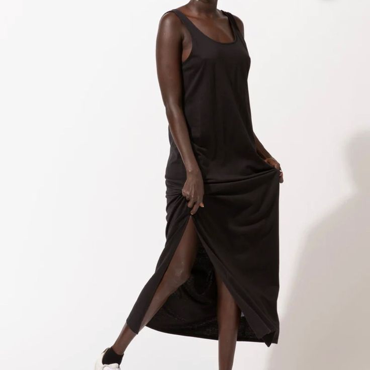 Your Classic Tank Top, In Dress Form! Elegant And Flowy, With A High Low Bottom Hem. Super Comfortable And Stretchy Fabric In Timeless Black. Ethically Made From Sustainable Materials. 95% Lenzing Modal 5% Spandex. Size Xs, Measures Approximately 15”Ptp 40-47”Length. Size L, Measures Approximately 18”Ptp 42-49”Length. Brand New With Tags, Retails For $68 Black Stretch Longline Midi Dress, Black Stretch Longline Maxi Dress, Black Stretch Dresses With Side Slits, Black Stretch Dress With Side Slits, Black Stretch Maxi Dress With Side Slits, Black Longline Maxi Dress For Summer, Black Longline Dress With Side Slits, Casual Black Maxi Dress With Side Slits, Casual Black Midi Dress With Side Slits