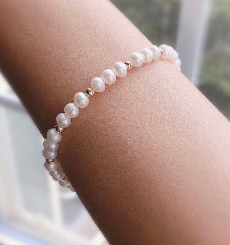 "* DETAILS * - Freshwater Pearl Potato Shape White Pearls Size Approx.5mm - 14k Gold Filled Beads 3mm - All components are 14k Gold Filled  👉🏻 Fits wrist size from 6\" to 7.5\"  * CARE TIPS * - Perfumes: Be sure any perfume or lotions are completely absorbed into skin. - Hair products: Apply all hair products before putting on jewelry. - Swimming: Remove all jewelry before swimming or getting into hot tubes. - No sunlight: Store away from heat, direct sunlight, window sills and vents. - Bedtim Classic Single Strand Beaded Bracelets As Gift, Classic Single Strand Beaded Bracelet For Gift, Classic Single Strand Beaded Bracelet As Gift, Dainty White Bracelets For Anniversary, Dainty White Bracelet For Anniversary, Dainty White Beaded Bracelet For Anniversary, Delicate Beaded Bracelets For Anniversary, Pearl White Round Beaded Bracelets For Anniversary, Gift Single Strand Round Gold Bracelet