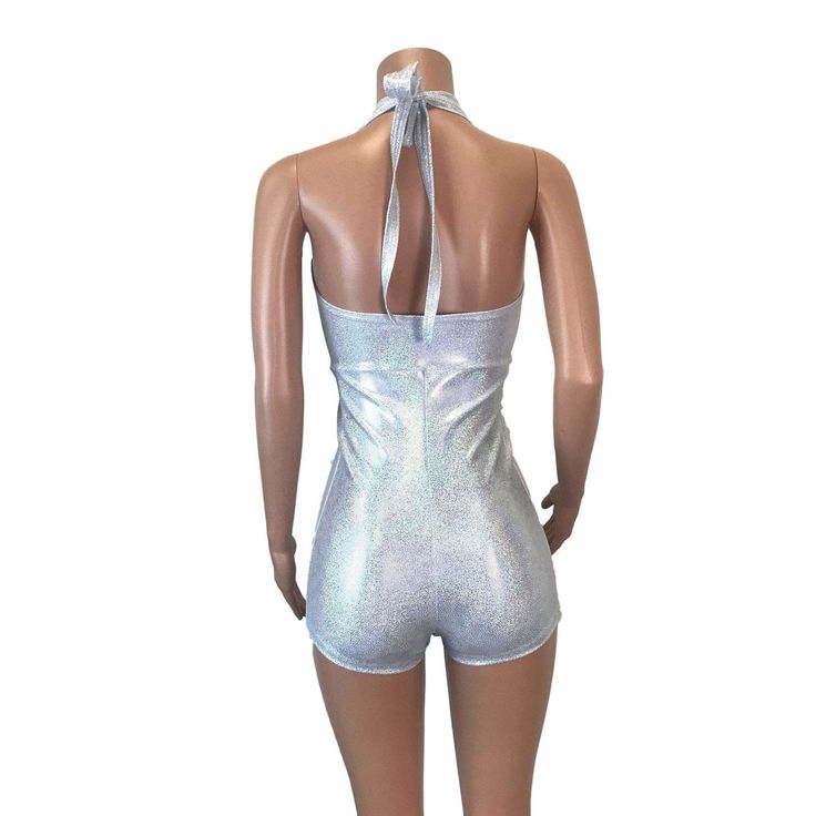 Made of our silver on white holographic spandex, this halter romper hugs the body, but offers plenty of stretch. The halter top ties at the back of the neck. Our seamless front design is extremely comfortable and prevents camel toe. Wear this to a rave, to a festival, or an aerial performance. Aerial Performance, White Holographic, Silver Holographic, Halter Romper, Front Design, Halter Top, Camel, Rompers, Spandex