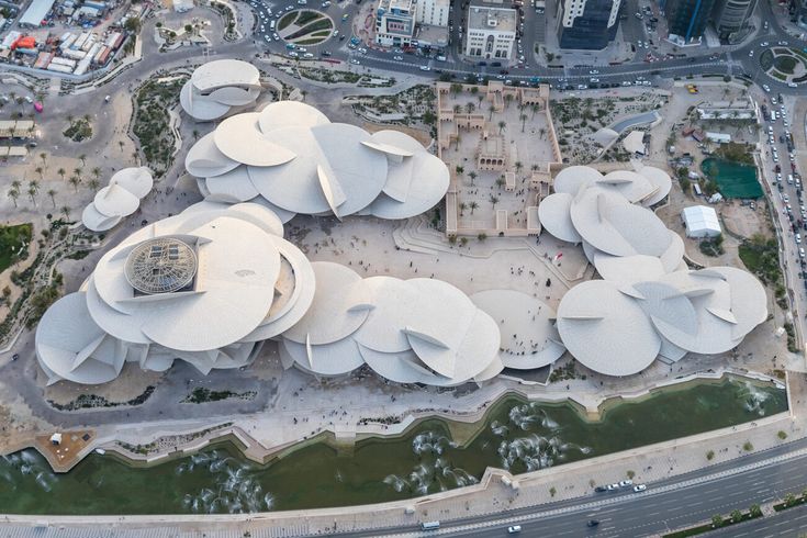 an aerial view of a building with many circular structures