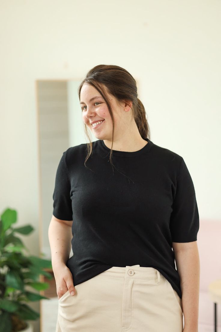 Our Lundy Top is such a great top to add to your wardrobe. This soft knit top is perfect for wearing alone or layering under a shirt or shacket! - Crew neck - Short sleeve - Soft knit - Material: 100% Viscose - Model is 5’7" & wears a small. She is wearing a small in the cream top. - Model is 5’6" & wears a M/L. She is wearing a large in the black top. Color Disclaimer: Actual colors may vary due to computer monitors. *Measurements are taken flat, and then doubled.* Size Bust Length Sleeve Small Versatile Everyday Sweater, Stretch T-shirt For Workwear In Fall, Versatile Crew Neck Fall Blouse, Fall Crew Neck Versatile Blouse, Knit Short Sleeve T-shirt For Work, Fall Layering Blouse With Crew Neck, Stretch Soft Knit Top For Layering, Effortless Stretch Tops For Everyday, Stretch Tops For Everyday Fall Wear