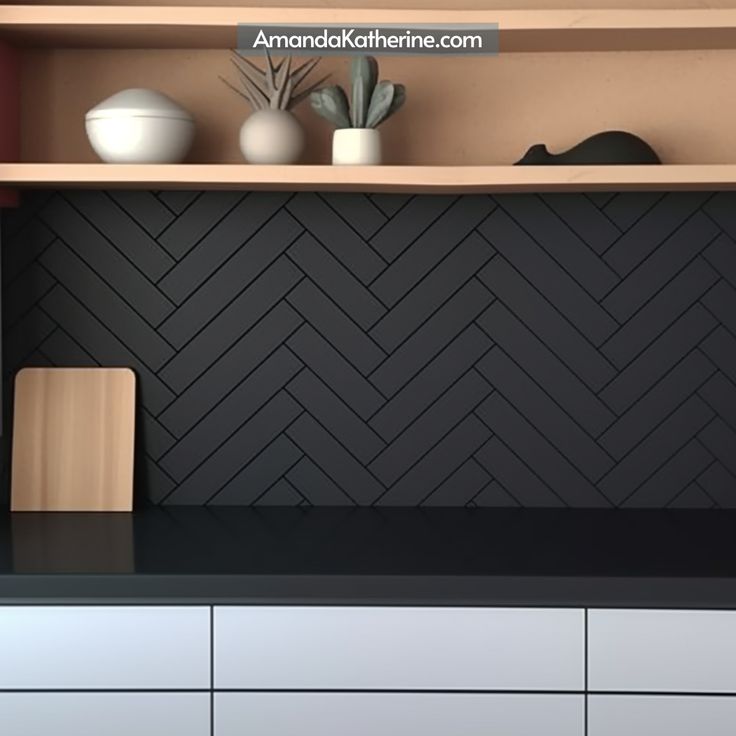 a kitchen with black and white tiles on the backsplash, counter tops and cupboards