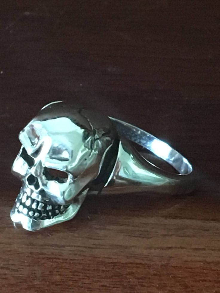 This  Skull Ring is handmade in 925 sterling silver by Pamanova in U.S.A. It is antiqued by oxidizing and polished to show the details of the design. This ring  is the perfect gift for yourself or a loved one.   Finger size: 8 in U.S.A -This listing includes only the Silver Skull Ring . The other skull pieces are offered in separate listings Sterling Silver Skull Ring Collectible, Classic Sterling Silver Skull Ring With Polished Finish, Collectible Sterling Silver Skull Ring, Hand Cast Sterling Silver Skull Ring, Classic Polished Skull Ring Collectible, Sterling Silver Skull Ring Hallmarked, Gothic Sterling Silver Skull Ring With Oxidized Finish, Gothic Oxidized Sterling Silver Skull Ring, Sterling Silver Skull Ring In White Gold