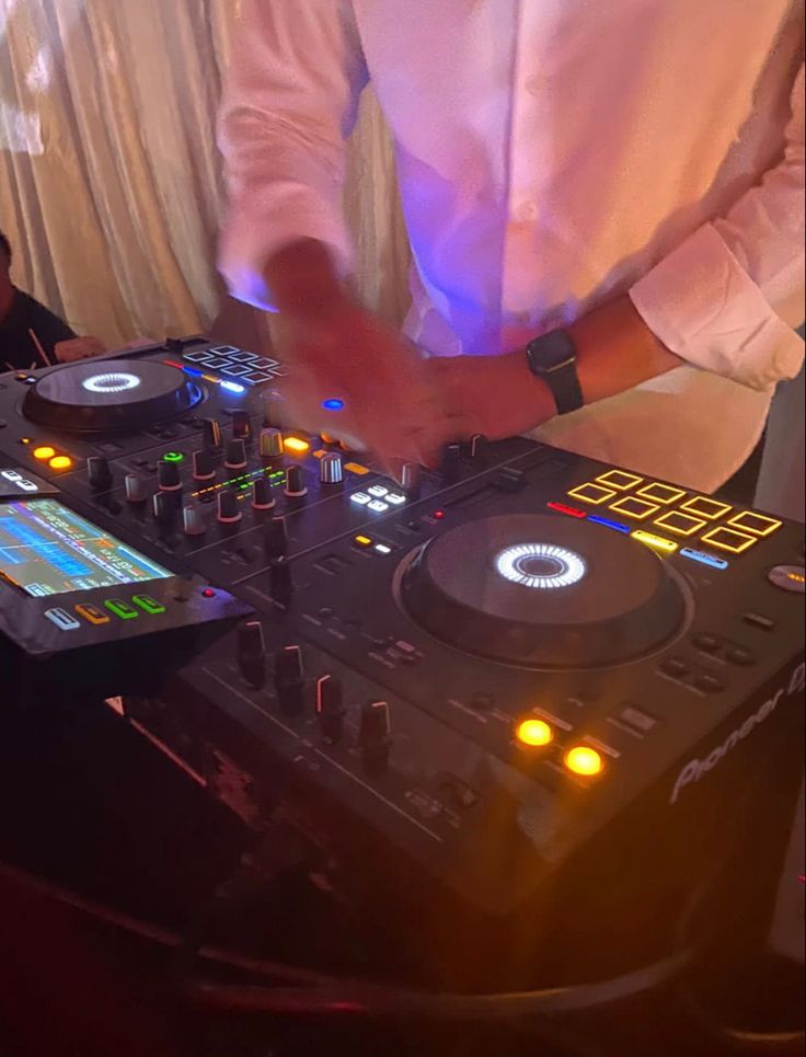 a dj is mixing music at a party