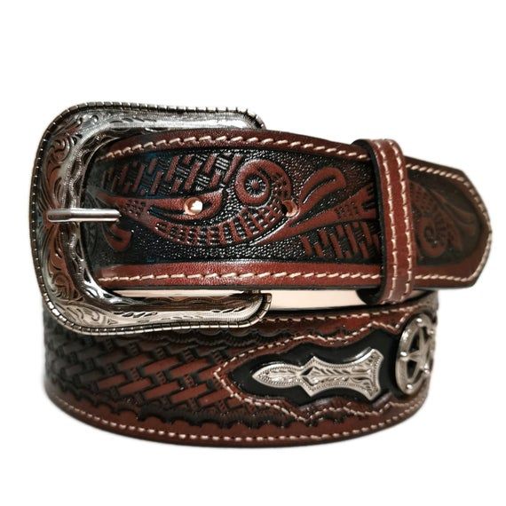 Western Leather Belt for HimA fashionable belt that screams “cowboy” all over! Use the cowboy Leather Belt for Him to secure your trouser or just use it to accessorize your style.•WITH A REMOVABLE BUCKLE DESIGN so that you can conveniently change buckles with your favorite one, this belt comes with screws. •LOOK LIKE A TRUE-BLUE COWBOY WITH ITS WESTERN DESIGN that will definitely level up your whole rodeo look.•HANDCRAFTED AND MADE WITH  GENUINE LEATHER so that all you get is a belt handmade wit Leather Belt Buckles For Rodeo, Hand Tooled Leather Belt Buckles For Rodeo, Western Leather Belt For Western-themed Events, Western Leather Belt Buckles For Rodeo, Leather Concho Belts For Western-themed Events, Rustic Leather Belt For Rodeo, Brown Leather Rodeo Belt, Brown Leather Belt For Rodeo, Western Belt Buckles For Rodeo