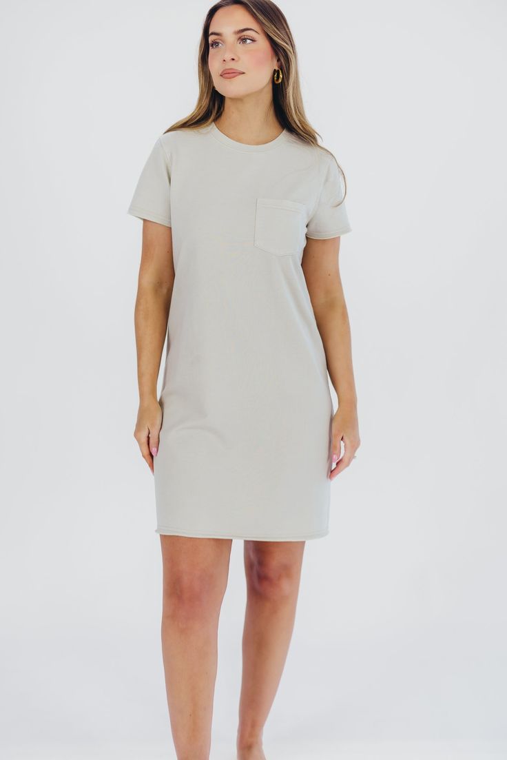 The ultimate travel dress just hit our shelves - meet the Raiya T-Shirt Dress, your new go-to! This cotton-blend mini dress is relaxed and comfortable without sacrificing style; dress it up with mules or wedges, or dress it down with sneakers for versatile, multi-season wear! FIT: Runs true to size. MATERIAL: 60% Cotton, 40% Polyester. Hand wash cold. GARMENT DETAILS: Relaxed fit t-shirt dress in a mini length, with high crewneck, short sleeves, and single chest pocket. SIZE GUIDE: XS (0-2) / S (2-4) / M (6-8) / L (10-12) MODEL DETAILS: Mackenzie - Size S Heather - Size S Molly - Size XL Our Brunette Misses Model Our Blonde Misses Model Our Blonde Curve Model Bust 34" 34" 37" Waist 27.5" 27.5" 32" Hips 40.5" 37.5" 47" Height 5'7" 5'7" 5'7" Everyday Short Sleeve Relaxed Fit Dresses, Casual Solid Dresses For Everyday, Casual Solid Everyday Dress, Casual Loungewear Dress With Curved Hem, Relaxed Fit T-shirt Dress For Spring Daywear, Spring Relaxed Fit T-shirt Dress, Spring Everyday Relaxed Fit T-shirt Dress, Spring Knee-length T-shirt Dress For Loungewear, Chic Short Sleeve Mini Dress For Loungewear