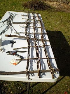 a white table topped with lots of branches and tools