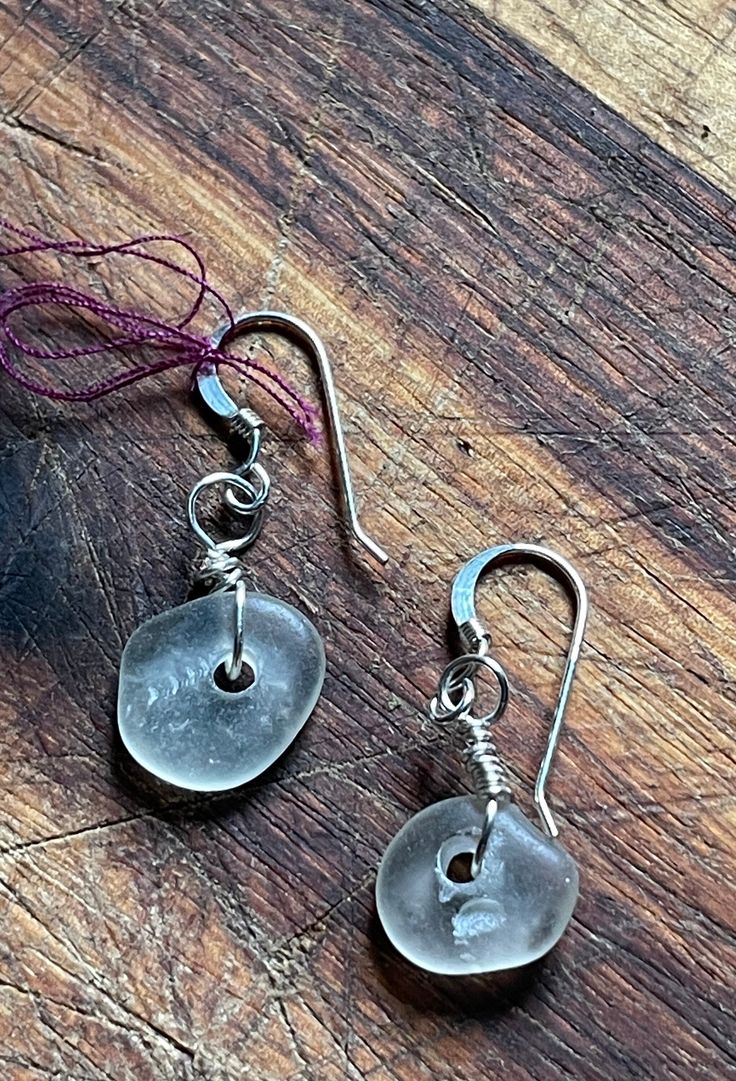 These beautiful Seaglass earrings are made with glass found on the beaches of Puerto Rico hand drilled and set to complete any outfit! Beach Earrings With Recycled Glass And Ear Wire, Beach Sea Glass Earrings With Ear Wire, Beach Earrings With Sea Glass And Ear Wire, Nickel-free Adjustable Sea Glass Earrings, Adjustable Nickel-free Sea Glass Earrings, Adjustable Nickel Free Sea Glass Earrings, Czech Glass Drop Earrings For Beach, Nickel-free Sea Glass Earrings For Jewelry Making, Glass Dangle Earrings For The Beach