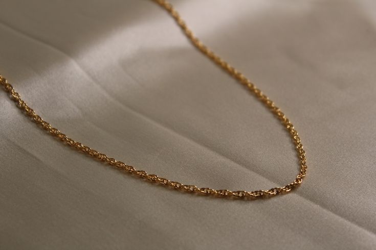 14k gold filled rope chain unisex gold chain available in different lengths Minimalist Rope Chain Link Jewelry, Minimalist Gold Rope Chain Necklace, Elegant Gold Rope Chain Necklace With Adjustable Chain, Elegant Gold Adjustable Rope Chain Necklace, Dainty Gold Jewelry With Rope Chain, Classic Rope Chain Necklace With Oval Link, Gold Rope Chain Necklace With Figaro Style, Minimalist Gold Rope Chain Necklace With Adjustable Chain, Classic Oval Link Rope Chain Necklace