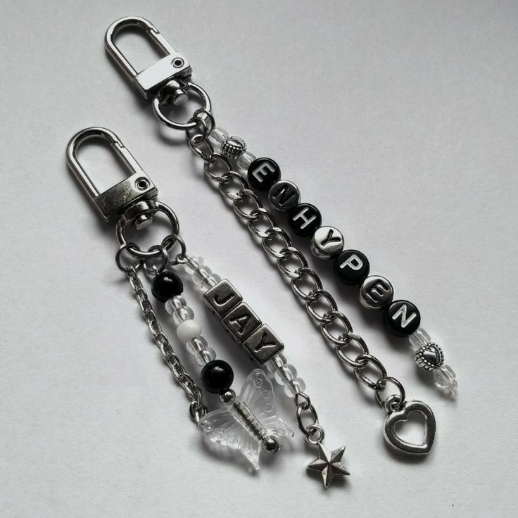 two key chains with charms attached to them