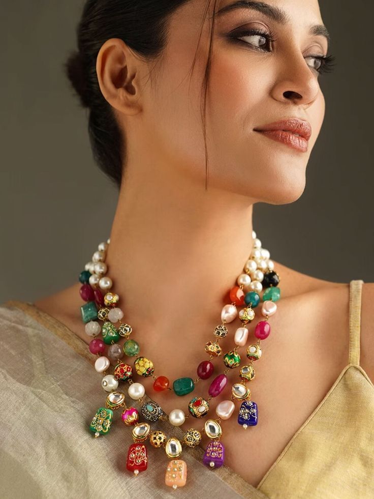 Abdesigns Enhance your elegance with our Multicoloured Kundan Inspired Stones Necklace. This Kundan Necklace embodies the richness of Bollywood Jewelry, making it a must-have for any ethnic jewelry lover. The Navrattan Necklace design features a beautiful array of colorful stones, perfect for any festive occasion. Length: Mala is 28 Inches + Adjustable Thread Material - Brass Plating - Gold Gemstone: White Kundan, Mix Gems & Beads Closure: Pushback/Lobster Hook  Looking for something unique? Che Festive Multicolor Gemstone Beads Jewelry, Multicolor Gemstone Bead Necklaces For Festive Occasions, Festive Multicolor Gemstone Bead Necklaces, Fusion Style Multicolor Temple Necklace For Festive Occasions, Elegant Multicolor Necklace For Festivals, Elegant Multicolor Necklaces For Festivals, Festive Multicolor Fusion Temple Necklace, Multicolor Gemstone Beads Necklace For Wedding, Multicolor Gemstone Temple Necklace For Festive Occasions