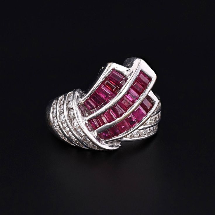 Rubies, the birthstone of July, have longstanding associations with passionate love and power. This retro ring (circa 1940-1950) features rubies and diamonds set in 14k white gold. The ring is in excellent condition. It is currently a size 6.75 inches, but can be resized free of charge. We have many other fantastic offerings of antique and vintage jewelry posted on our Etsy store, so please consider browsing our other items. We send all items in individually packaged gift boxes. + Trademark Anti White Gold Ruby Multi-stone Diamond Ring, White Gold Ruby Diamond Ring With Multi-stone, Platinum Ruby Ring With Diamond Accents, Red Platinum Rings With Diamond Accents, Platinum Rings With Red Diamond Accents, Anniversary Hallmarked Platinum Ruby Ring, Anniversary Platinum Ruby Ring With Diamond Accents, Art Deco Ruby Jewelry With Brilliant Cut, Platinum Hallmarked Ruby Ring