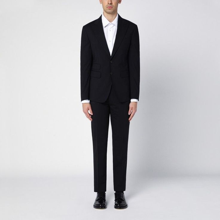 Navy Blue Wool Single Breasted Suit From Dsquared2, Featuring A Front Button Fastening, Long Sleeves, Buttoned Cuffs, Deep Lapels, Three Front Flap Pockets, A Welt Pocket On The Chest And Black Wool Trousers, Featuring Two Welt Pockets With A Button On The Back. Model Wears Size 50 It Model Measurements: Height: 185 Cm Chest: 100 Cm Waist: 83 Cm Hips: 92 Cm Size Type: It Material: Wool Sku: 2f-S74ft0457s40320/P_dsqua-900_202 Welcome To The Official Luosophy Poshmark Closet! Luosophy Is A Luxury Luxury Business Suits With Button Cuffs, Slim Fit Suits With Button Closure For Office, Designer Single Breasted Suits For Work, Designer Fitted Suits For Office, Designer Single-breasted Suits For Work, Business Suits With Button Cuffs And Suit Collar, Slim Fit Business Suits With Button Closure, Slim Fit Suits With Button Closure For Business, Tailored Suits With Button Closure For Formal Occasions