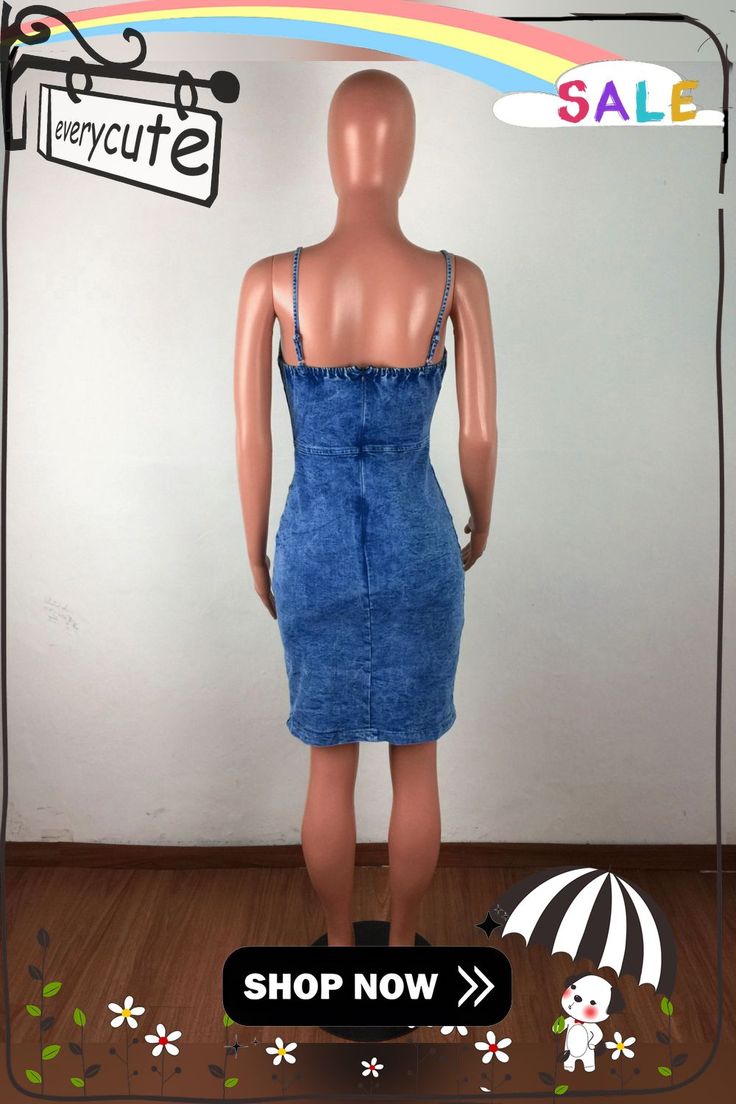 a female mannequin wearing a denim dress and holding an umbrella