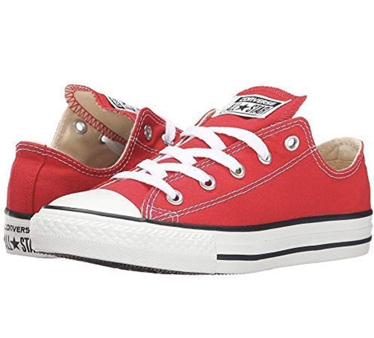 a pair of red sneakers with white laces