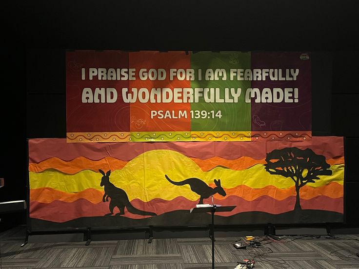 a large banner with kangaroos and trees on it