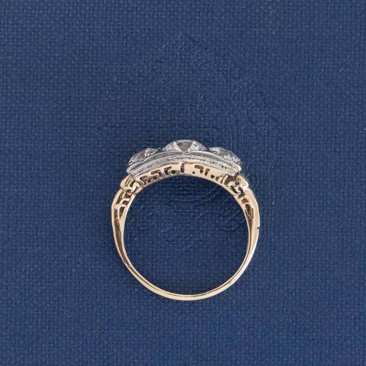 an antique diamond ring on a blue background