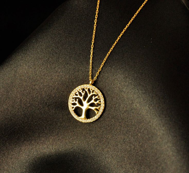 "10k 14k 18k Gold Tree of Life Necklace, Tree Necklace, Life Tree Pendant, Family Necklace,Tree of Life Charm,Christmas Gift,Mothers Day Gift Tree of Life For centuries, the Tree of Life, a highly symbolic design for many cultures around the world, has become very popular in jewellery. This popularity is increasing day by day.  A universal symbol found in almost every spiritual and cultural tradition of the world, the Tree of Life has many meanings besides being known as a symbol of immortality. Gold Tree Of Life, Necklace Tree, Gift Tree, Life Tree, Mother Christmas Gifts, Family Necklace, Gold Tree, Tree Necklace, Tree Of Life Necklace