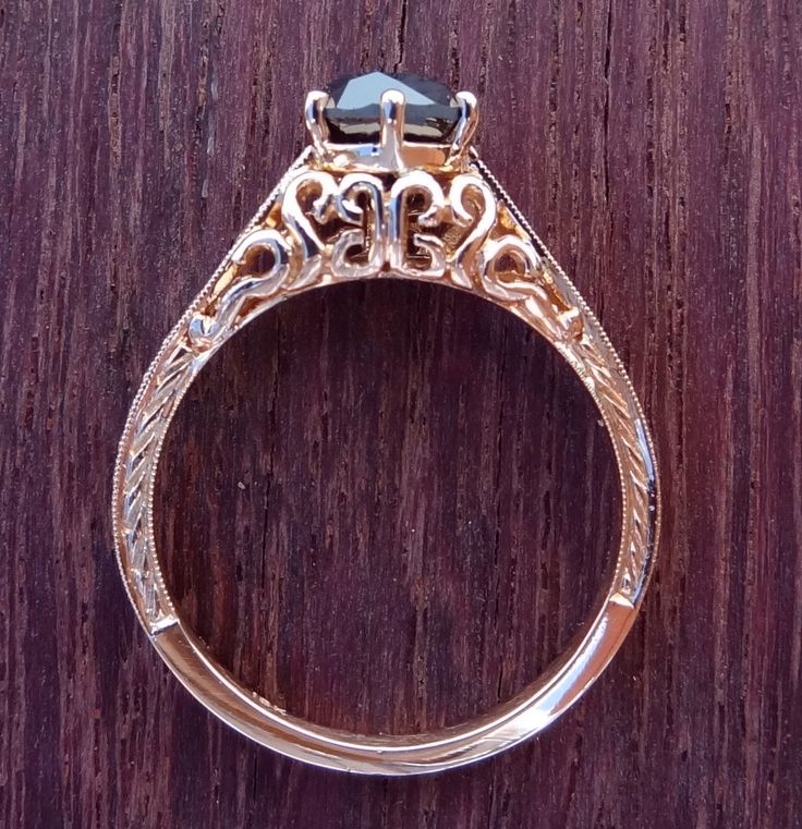 This beautiful, Petite antique style engagement ring is hand made in 14k solid pink gold / rose gold. The diamonds are 100% natural. The center black diamond weight is approximately .95 cts. The 6 side diamonds weight is over .10cts and are VS clarity and G color range. Total weight of all diamonds is approximately 1.05 cts. We can make it any size from 5-7 and you still be able to return it within the listed time frame. Sizing outside of that range requires a re-size fee if for any reason the r Formal 14k Rose Gold Jewelry Stamped 14k, Heirloom 14k Rose Gold Diamond Cut Jewelry, Victorian Style Engraved Round Cut Jewelry, 14k Gold Engraved Filigree Ring As Gift, Collectible Heirloom Rose Gold Jewelry, Ornate 14k Gold Promise Ring, Heirloom Oval 14k Rose Gold Jewelry, Ornate Yellow Gold Engraved Ring As Gift, Ornate 14k Stamped Rings As Gifts