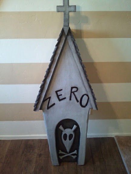 a cat house that has the word zero written on it and an owl in front