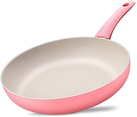 an empty frying pan with a pink handle on a white background, close up