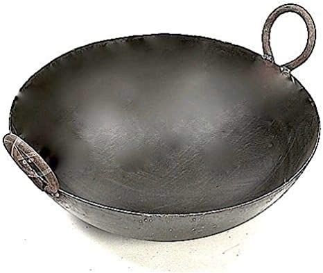 an empty frying pan on a white background