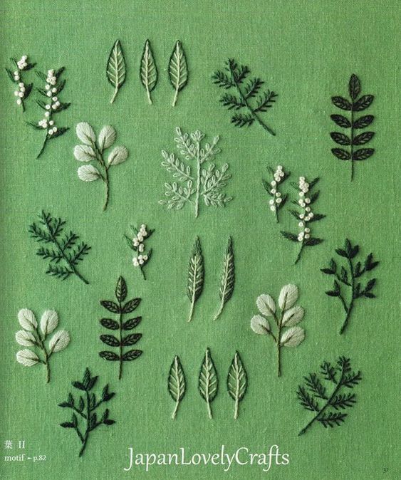 the japanese lovely crafts book is filled with handmade flowers and leaves, which are embroidered onto green fabric