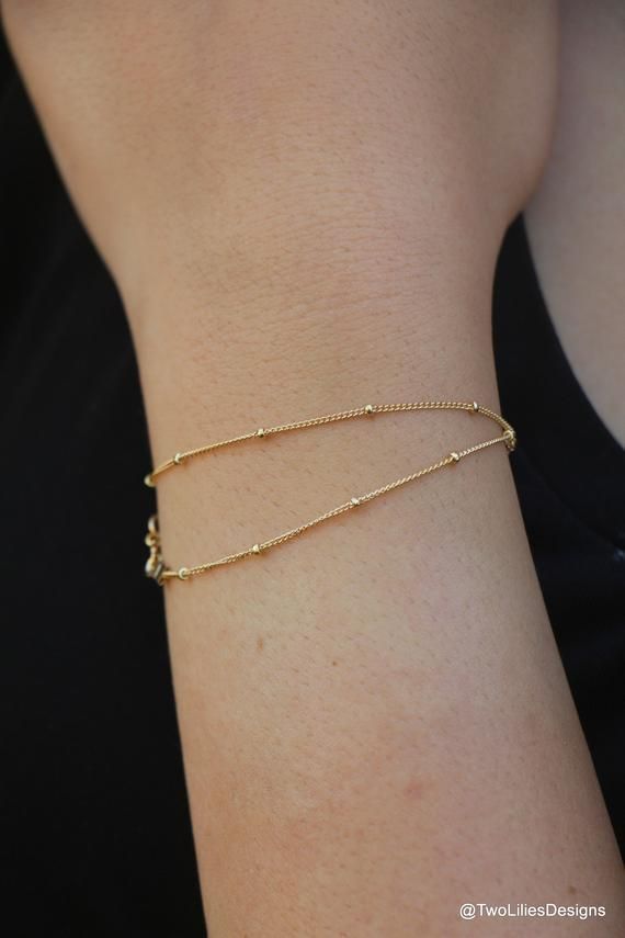 This contains an image of: {{ pinTitle }} 14k Gold Filled Satellite Chain Bracelet As Gift, Dainty Gold Bracelet With Adjustable Chain, Dainty Double Chain Bracelet For Everyday, Dainty Delicate Chain Bracelets For Layering, Everyday Dainty Double Chain Bracelet, Minimalist Double Chain Bracelet, Minimalist Satellite Chain Bracelet As Gift, Minimalist Everyday Bracelets With Double Chain, Minimalist Satellite Chain Bracelet Gift