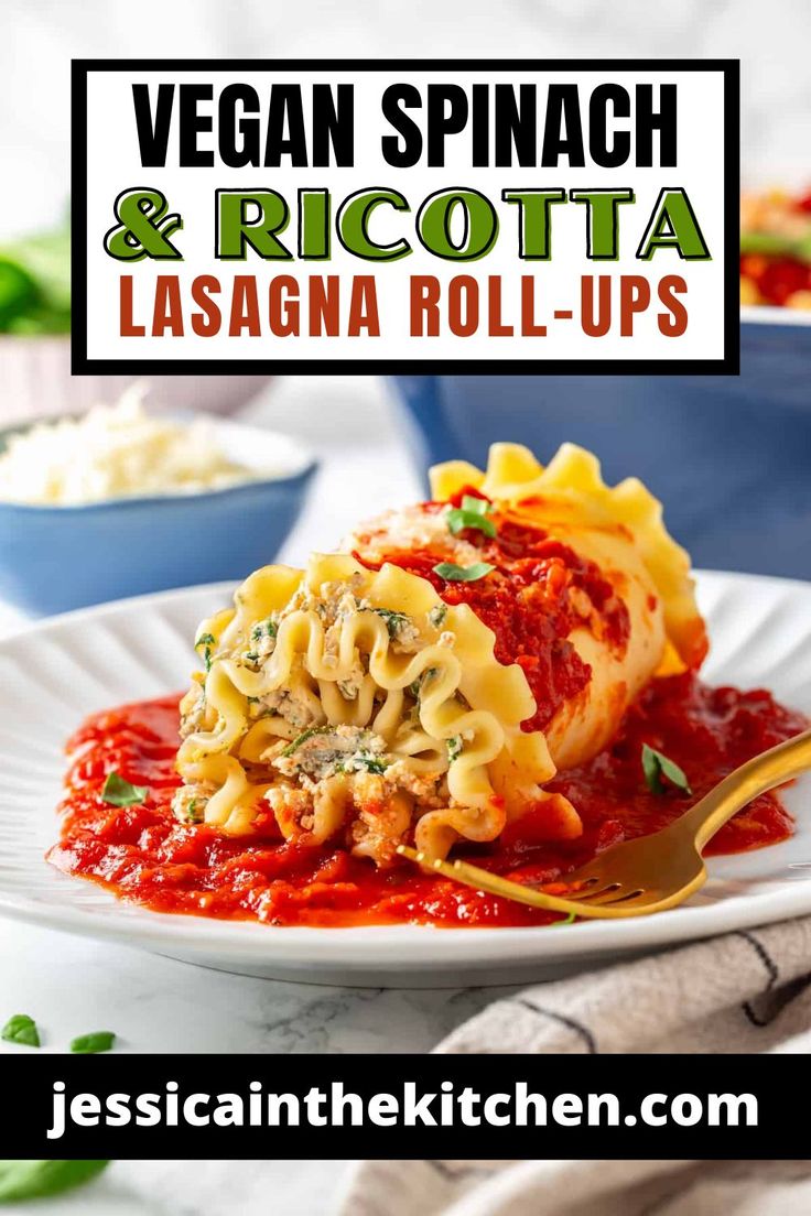 vegan spinach and ricotta lasagna roll - ups on a white plate