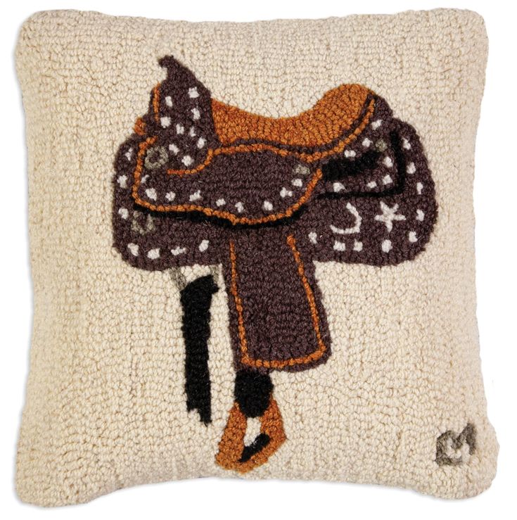 a pillow with a horse saddle on it