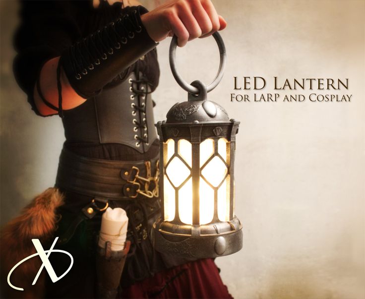 a woman holding a lantern in her hand with the words led lantern for tarp and cosplay