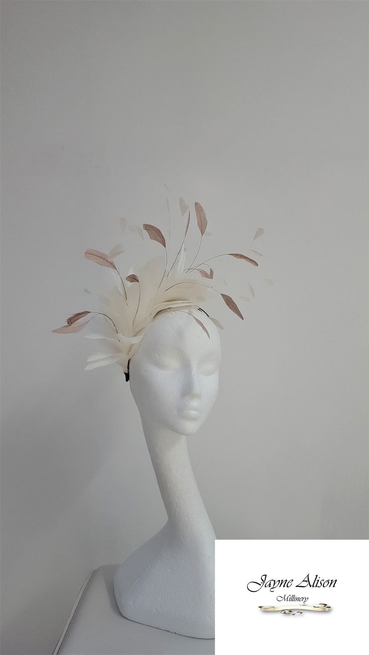 Delicate feather fascinator in ivory diamond tip nagoire feathers create this dancing headpiece.  An abundance of ivory and contrasting coffee coq feathers sway in the breeze.  Sits on a headband.  Can be made in a variety of colours/combinations. This item has sold, however, similar pieces can be made in a variety of colours.  Please ask for details.  As every piece is handmade, some differences can occur from the photos listed on this site.  Made to order/bespoke/custom orders are non-refundab Elegant Feather Trim Headband Fascinator, Elegant Feather Trimmed Fascinator Headband, Elegant Feather Trim Headband Hat, Elegant Feather Trim Headband For Royal Ascot, Elegant Mini Hats With Feathers On Headband, Elegant Adjustable Ostrich Feather Fascinator, Elegant Adjustable Fascinator With Ostrich Feathers, Elegant Ostrich Feather Headpieces, White Ostrich Feather Wedding Headpiece