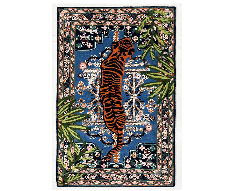 a rug with a tiger on it in the middle of flowers and leaves, against a white background