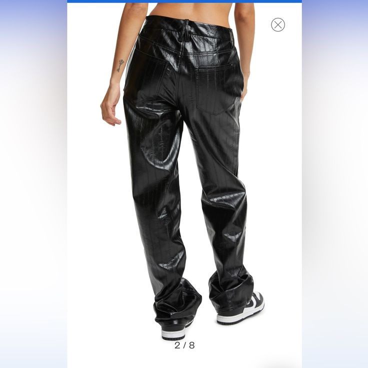 Show Off Retro '90s Style In High-Waisted Pants Cut In A Loose Straight-Leg Silhouette From Textured Faux Leather. Zip Fly With Button Closure Five-Pocket Style 100% Polyurethane Faux Leather Dry Clean Imported Model Stats: 5'10" Height, 32" Bust, 25" Waist, 36" Hip. Model Is Wearing Size 4. Fitted Leather Pants For Streetwear, Trendy Leather Trousers For Streetwear, Chic Winter Streetwear Bottoms, 90s High Waist Winter Bottoms, Spring Streetwear Wide Leg Leather Pants, Chic Spring Leather Pants For Streetwear, Fitted Leather Pants With Belt Loops For Streetwear, Trendy Fitted Leather Pants For Streetwear, High Waist Leather Pants For Winter Streetwear