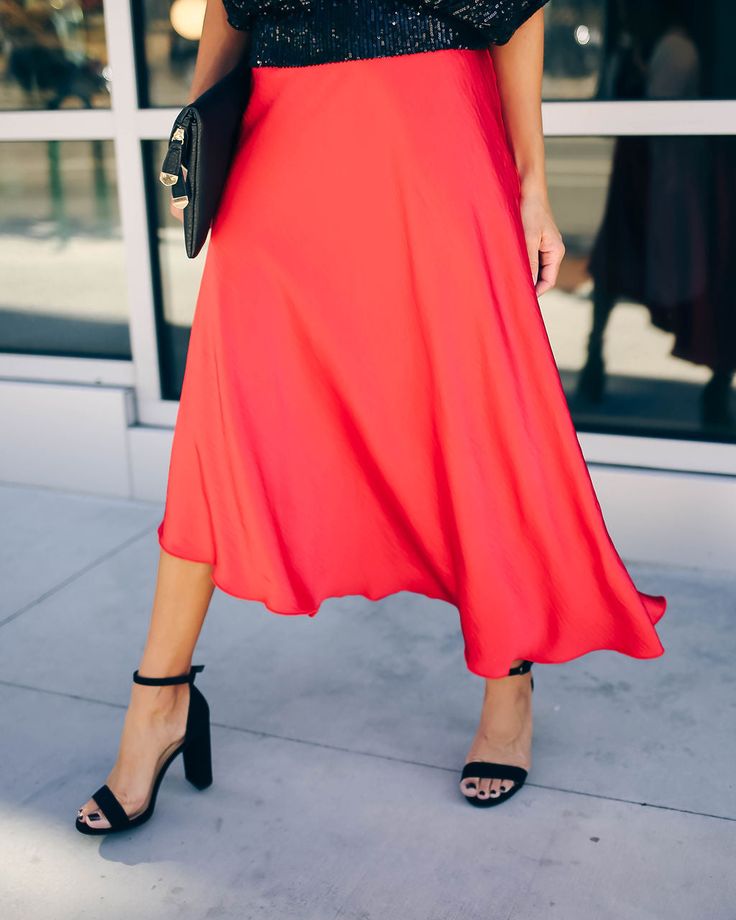 Make a bold statement this party season in our State Of Bliss Satin Asymmetrical Midi Skirt! Crafted in a jewel toned red hue on a soft and satiny base. The relaxed midi silhouette features a structured waistband for defined and comfortable wear. Finished with an asymmetrical hemline and side zipper closure. Styled with the Chloe Mini Necklace. Mosaic Coin Necklace. All Fun And Games Sequin Top. Royale Heels and the Stella Crossbody Envelope Zip Clutch. Relaxed Fit Structured Waistband C Non Ela Asymmetrical Midi Skirt, Mini Necklace, Fun And Games, Ribbed Mini Dress, Silver Dress, Sequin Top, Coin Necklace, Midi Length, Side Zipper