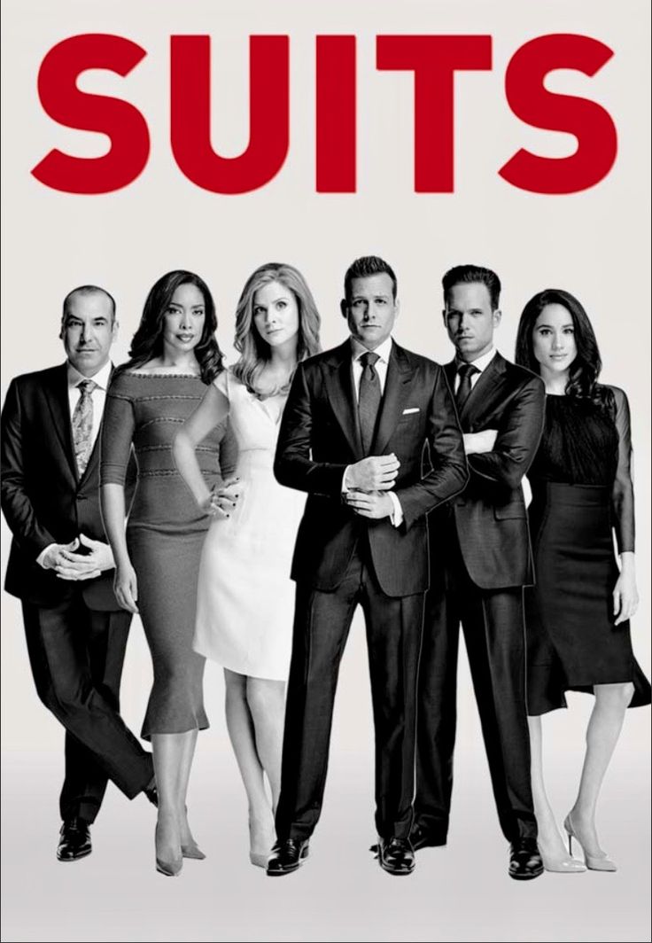 the cast of suits standing in front of a white background with red lettering on it