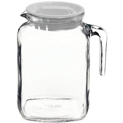 a clear glass jar with a lid and handle on a white background for use as a storage container