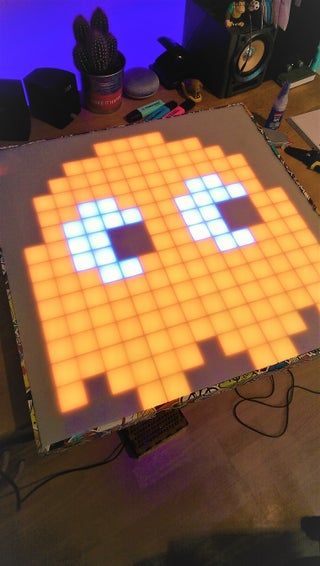 an old - school video game is projected onto the floor