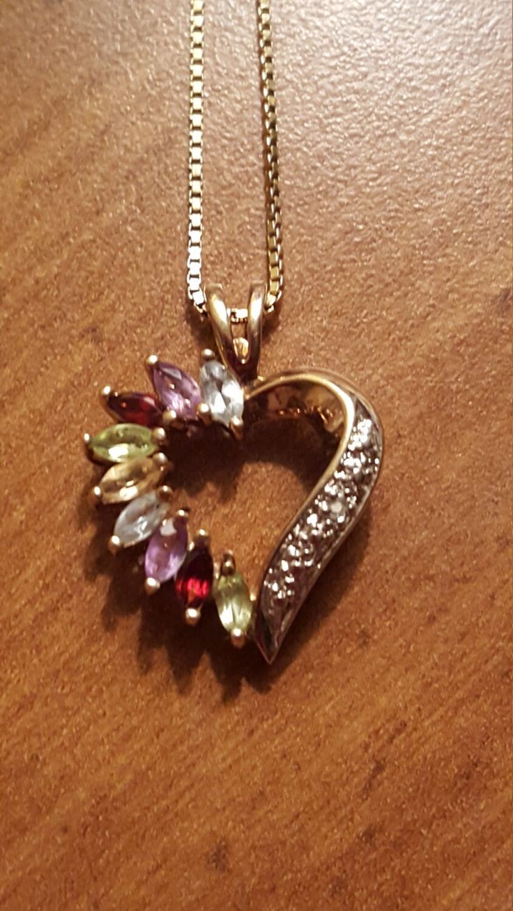 This is a gorgeous vintage sterling silver gold overlay multistone heart pendant on an Italian sterling silver gold overlay necklace. The pendant has aquamarine, amethyst,  red garnet, peridot, and citrine gemstones. The pendant and necklace are both in excellent vintage condition. The pendant measures 1 inch high by 1/2 Inch wide and the necklace measures 18 inches long. Marked Italy 925. Fine Jewelry Gemstone Necklace Collectible, Collectible Fine Jewelry Necklaces With Gemstones, Multicolor Fine Jewelry Collectible, Elegant Multi-stone Heart Cut Jewelry, Dainty Multi-stone Jewelry For Anniversary, Costume Jewelry With Gemstones, Valentine's Day Gemstone Pendant Jewelry, Yellow Gold Multi-stone Jewelry Gift, Multicolor Heart Cut Jewelry For Valentine's Day