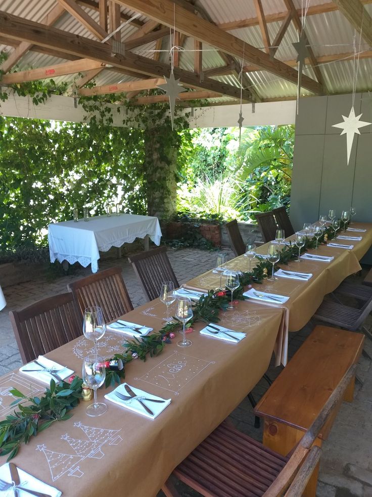 a long table is set with place settings