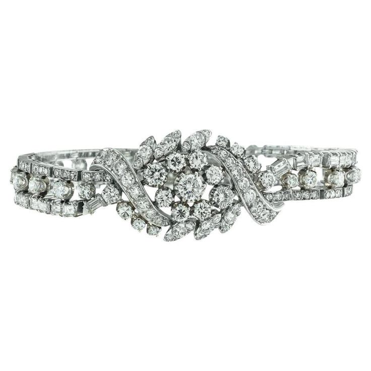 Vintage flexible 10.50 carats diamond and platinum bracelet circa 1950. ABOUT THIS ITEM: #B-DJ115D. Scroll down for specific details. This sparkling midcentury diamond bracelet feels and looks like wrapping the Milky Way around the wrist. Bright fiery diamonds are all you see. The design is an assertive statement of classic elegance from the period when it was made when jewels featuring large quantities of white diamonds mounted in white metal were all the rage. Observe the larger, curvaceous ce