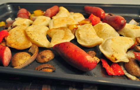 a tray filled with potato chips and hot dogs