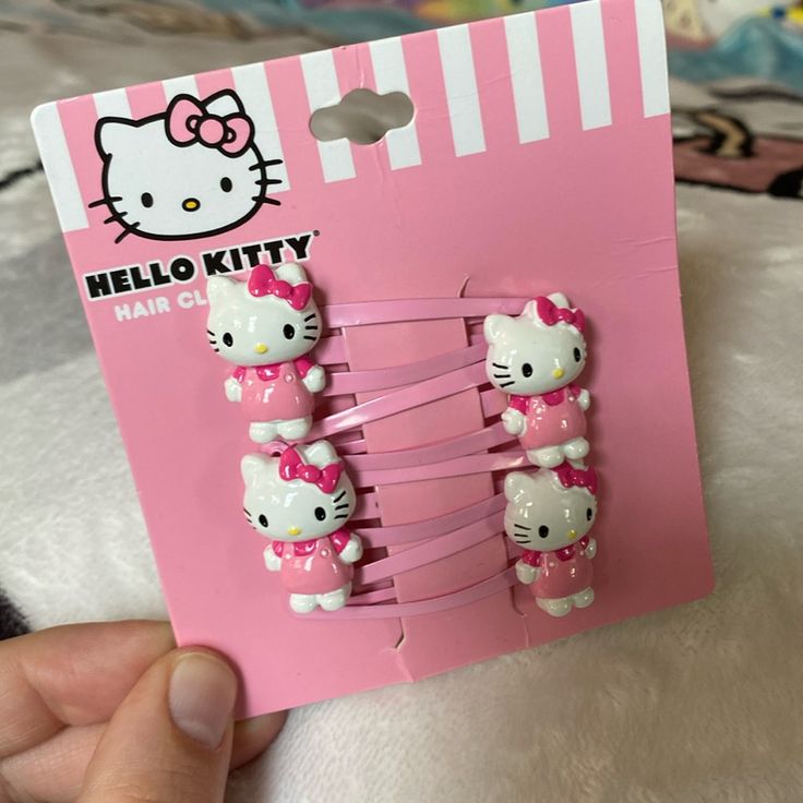 the hello kitty hair clips are pink and white