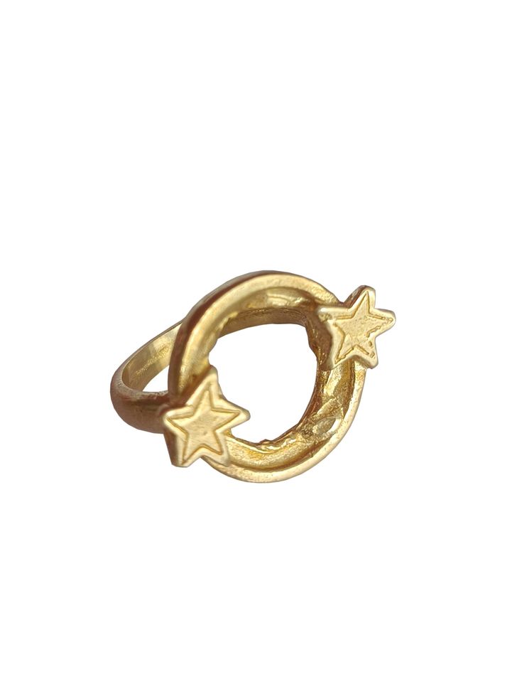 a gold ring with two stars on the middle and one star in the middle, against a white background