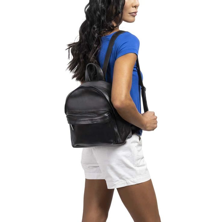 Mini Leather Backpack in black - model view On-the-go Softback Backpack With Anti-theft Pocket, On-the-go Backpack With Anti-theft Pocket, Everyday Softback Backpack With Zipper Closure, Softback Backpack With Anti-theft Pocket For On-the-go, Everyday Leather Backpack With Anti-theft Pocket, Leather Backpack With Anti-theft Pocket For Everyday, Black Leather Everyday Backpack With Anti-theft Pocket, Casual Backpack With Anti-theft Pocket For On-the-go, Classic Everyday Backpack With Zipper Closure