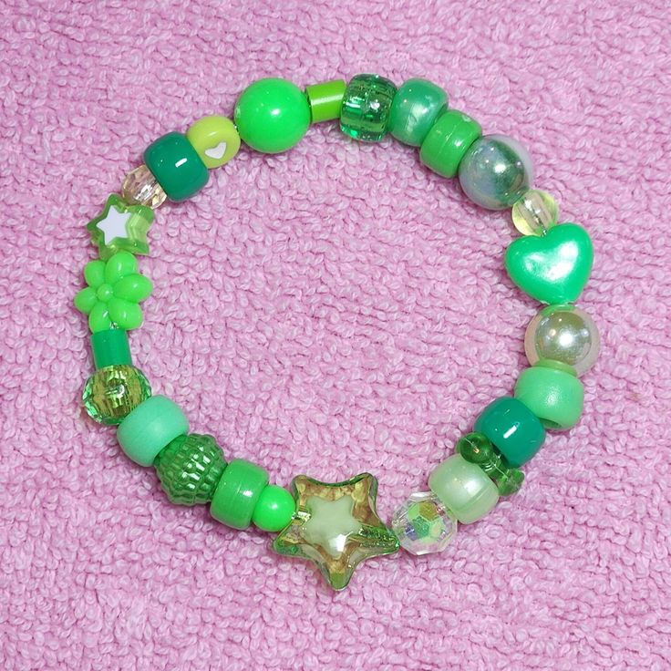 Green Beaded Bracelet With Spacer Beads For Friendship, Cute Green Beaded Bracelet For Friendship, Cute Green Beaded Bracelets For Friendship, Cute Green Round Beads Stretch Bracelet, Cute Green Stretch Bracelet With Round Beads, Green Friendship Bracelets With Spacer Beads As A Gift, Beach Green Jewelry With Heart Beads, Trendy Green Friendship Bracelets With Colorful Beads, Green Friendship Bracelets With Round Beads