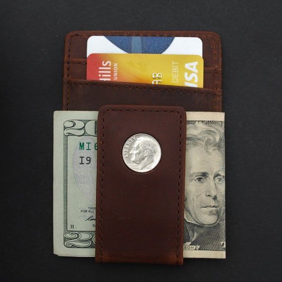 You are looking at a gorgeous Magnetic Money Clip and Wallet Combo, set with an authentic United States 1946 ~ 1964 Roosevelt Dime 90% Silver 10 Cent Coin. The coin is average circulated and in great condition. You need to pick a year from pull-down menu. The wallet is about 4.25"(108 mm) x 3.00"(75 mm), made of high quality Crazy Horse Water Buffalo Leather, brown color, brand new and has never been used before. It features a magnetic money clip with two card slots in front, four card slots on Vintage Wallet With Coin Pocket For Everyday Use, Vintage Everyday Wallet With Coin Pocket, Classic Bifold Coin Purse With Rfid Blocking, Vintage Bifold Wallet With Rfid Blocking, Everyday Vintage Wallet With Rfid Blocking, Classic Rfid Blocking Coin Purse, Classic Rectangular Coin Purse, Retro Bifold Wallets With Coin Pocket, Classic Bifold Coin Purse For Gift